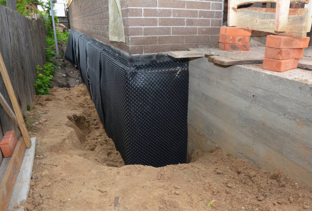Happy homeowners after waterproofing job in Lafayette Hill